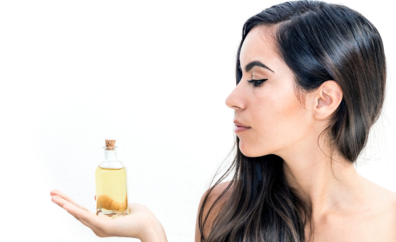 woman with argan oil bottle